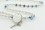 Custom white pearl and blue crystal baptism rosary, with an engraved disc for a boy’s baptism gift.