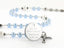 Custom light blue and white baptism rosary, with an engraved disc for a boy’s baptism gift.