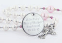 White and pink fancy baptism rosary with an engraved disc, for a girl’s baptism gift.