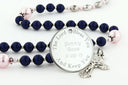 Custom dark blue and pink baptism rosary, with an engraved disc for a girl’s baptism gift.