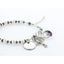 White pearl memorial rosary bracelet with an engraved disc and photo charm.