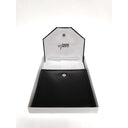 Black leather Keepsake rosary box half open in a white box. 