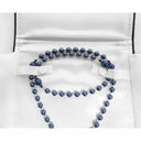 Rosary beads wrapped in a rosary box. 