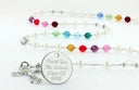 Custom rosary with white pearls and multiple color birthstones with an engraved disc.