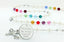 Custom rosary with white pearls and multiple color birthstones with an engraved disc.
