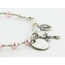 Pink pearl and crystal rosary bracelet with an engraved disc and charms for a catholic wedding gift. 